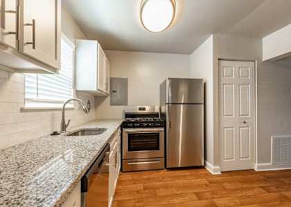 a kitchen with stainless steel appliances and a counter top