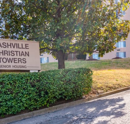 a sign for nashville christian towers in front of a building