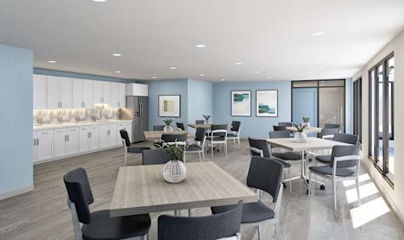 A modern dining room with a long table and chairs.