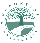 Brookside Apartments logo with a tree in the center.