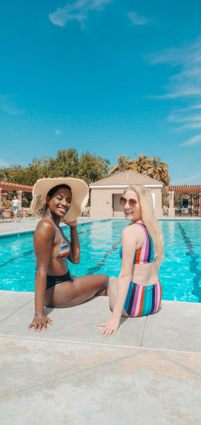 Women Sitting by Pool at Sanford Landing Apartments, Florida