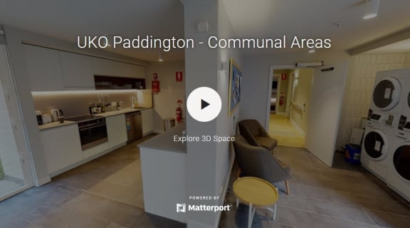 a view of a living room and a kitchen with the url to the
