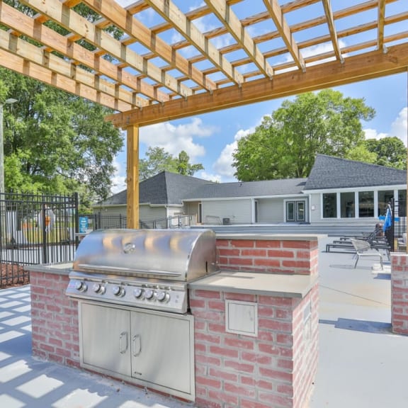 a grill in front of an apartment building