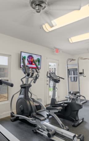 exercise equipment in the gym at the preserve at greatstone at Williamsburg Apartments, Grand Prairie, 75051