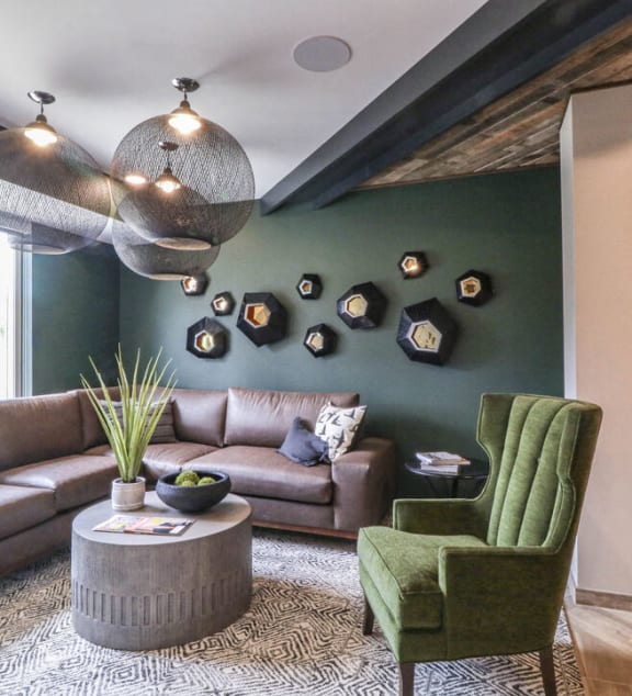 a living room with green walls and a brown couch at Vue at Bluestone, Duluth, Minnesota