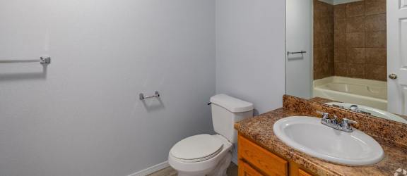 a bathroom with a sink toilet and bathtub