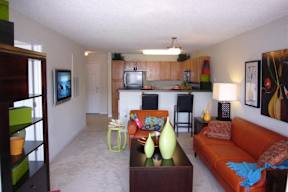 living room with a couch and table at Palmera, Columbia, SC