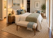 Thumbnail 1 of 11 - A bedroom with a large bed and a bench in front of it at Lifestyle at Shreveport in Shreveport, LA, 71109.