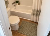 Thumbnail 4 of 11 - A white toilet sits next to a bathtub in a bathroom at Lifestyle at Shreveport in Shreveport, LA, 71109.