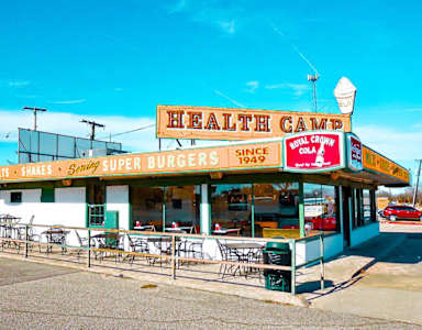 A restaurant named Health Camp serves burgers and shakes.