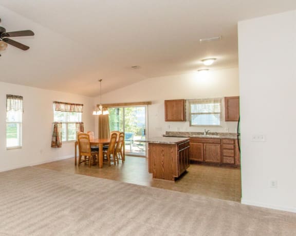 an open floor plan with a kitchen and dining area