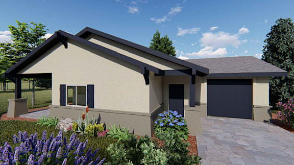 A modern house with a garage and a garden in front.