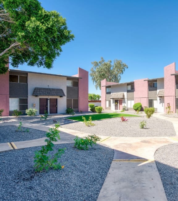 a street view of an apartment complex with trees and landscaping a street view of an apartment complex with trees and landscaping at Connect on Missouri, Phoenix, AZ