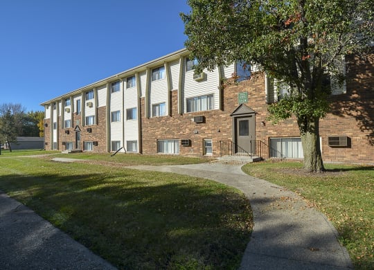 Paved Sidewalk Leading to an Entry Way Door at Timberland at Crestbruck
