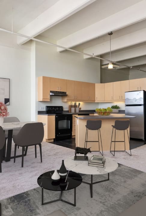 a living room with a kitchen and a dining room