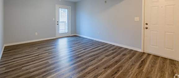 a bedroom with blue walls and a white door