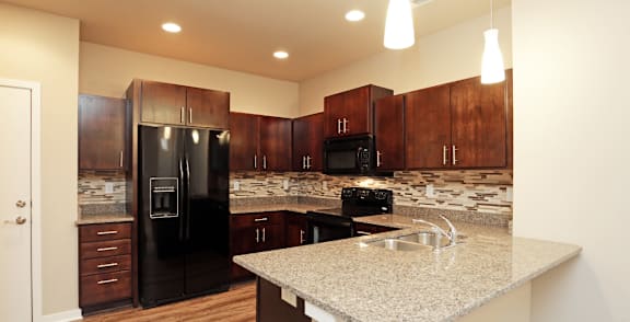 Fully Equipped Kitchen With Modern Appliances at 7th Street Brownstones, Indigo Living, Iowa