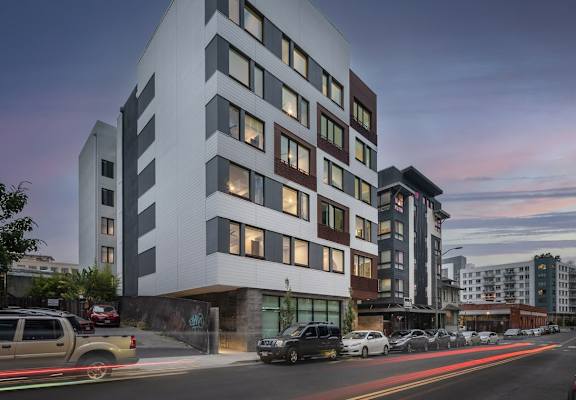 Rendering of Electric Lofts Apartments Building Exterior and Street Corner