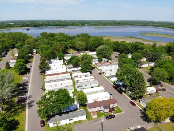 an aerial view of a trailer park with a body of water