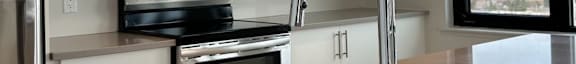 a kitchen with a sink and a microwave