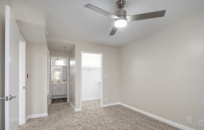 an empty living room with a ceiling fan at Huntington Terrace North Senior, California, 92648