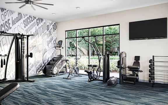 a home gym with exercise equipment and a large window