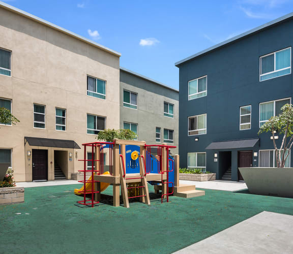 Playground and building exterior, MacArthur Park Apartments, Los Angeles, CA