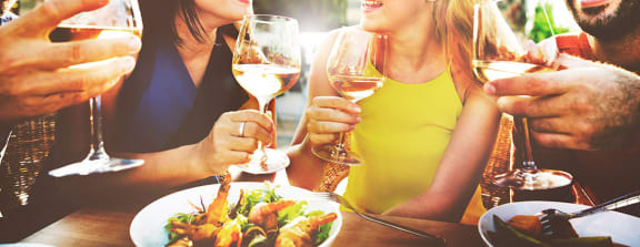 Friends dining out with wine at Crocker Village – Single Family Homes, Sacramento, CA 95818
