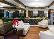Thumbnail 19 of 20 - Apartment Lobby With White Couches