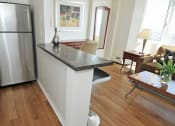 Thumbnail 5 of 9 - Kitchen With White Cabinets and Stainless Steel Appliances