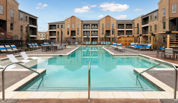 Swimming pool and pool deck at Alta 3Eighty Apartments in Aubrey, Texas