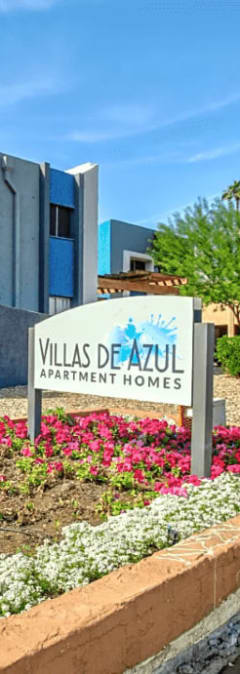 a sign in front of a building with a sign for the villa del mar