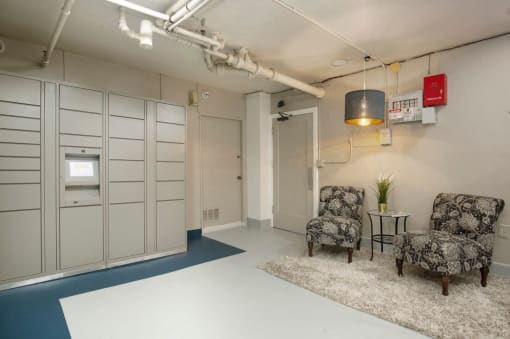 Image of Laundry Room with Cozy Chairs and Package Receiving Lockers at Stockbridge Apartment Homes, Seattle, Washington