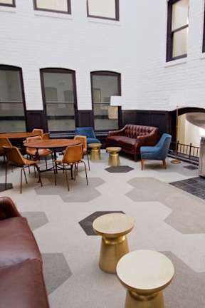 A white building with a black and white checkered floor.