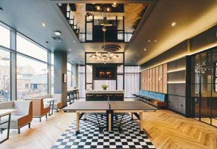 a room filled with furniture and a large window