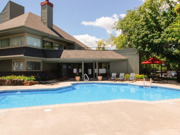 a swimming pool in front of a house