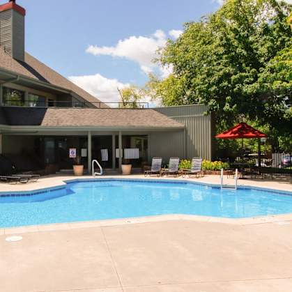 a swimming pool in front of a house