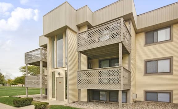 A modern building with a balcony and a window.