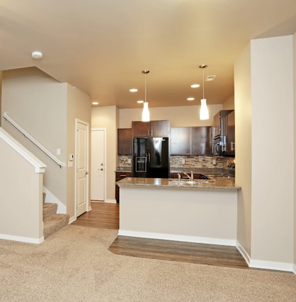 Spacious carpeted Living Room at 7th Street Brownstones, Iowa