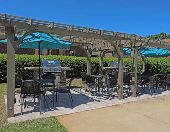 a patio with umbrellas and tables