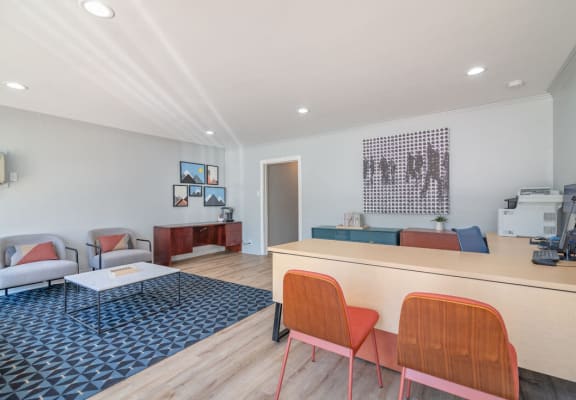 a living room with a couch and a table at The Flats on Addison, California, 91423