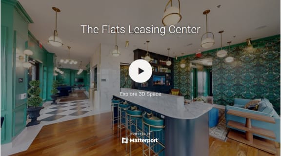 the flats leasing center with a marble counter top and bar stools