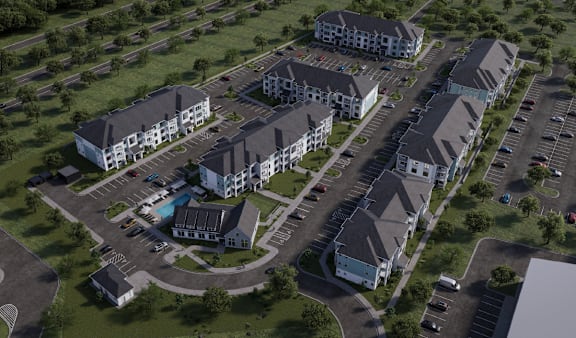 A bird's eye view of a residential complex with multiple buildings and parking lots.