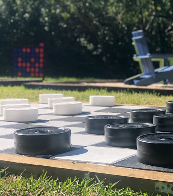A chess board with black and white pieces on it.