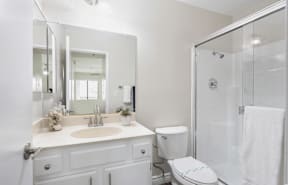 a white bathroom with a shower sink and toilet at Huntington Terrace North Senior, Huntington Beach, 92648