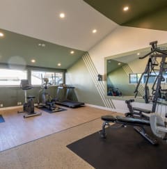 a gym with weights at Diablo Vista Apartments, Livermore