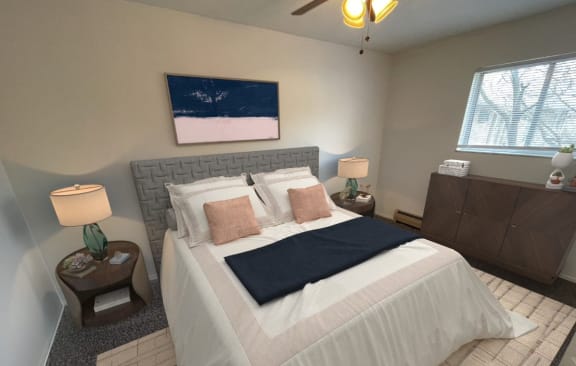 a bedroom with a bed and two night stands