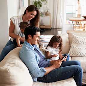 A Family of Four Sitting Together at Encino Palms Apartments, Encino, CA, 91316
