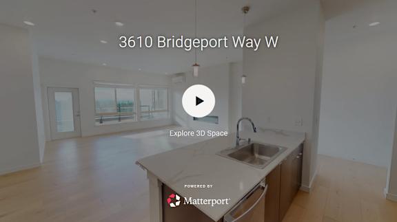 A kitchen with a sink and a play button overlay.