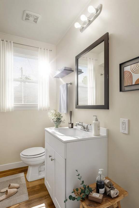 A bathroom with a white toilet and sink.